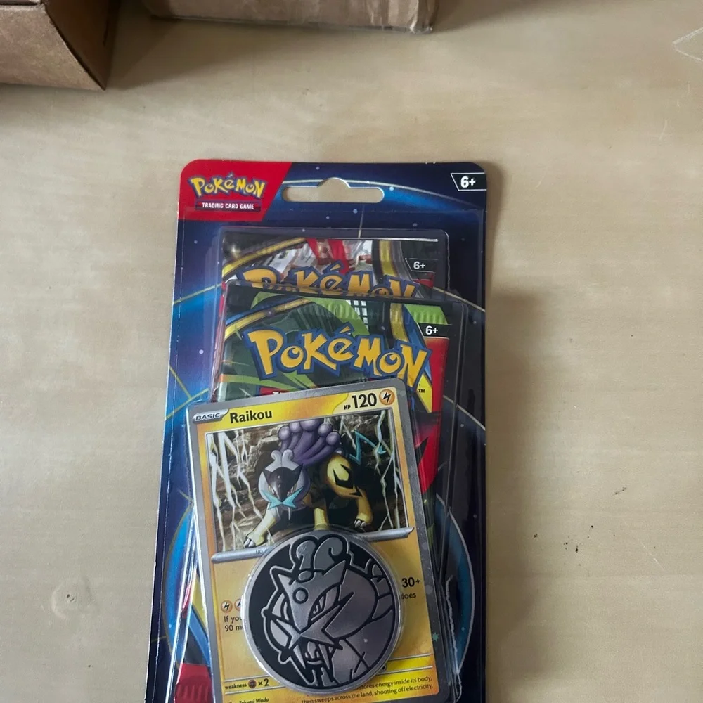 Lot of 10 Pokémon TCG booster double pack with two packs inside featuring Raikou